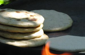 A stack of thick corn tortillas